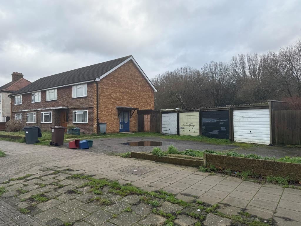 Lot: 125 - FREEHOLD GROUND RENT INVESTMENT - View of property showing garages